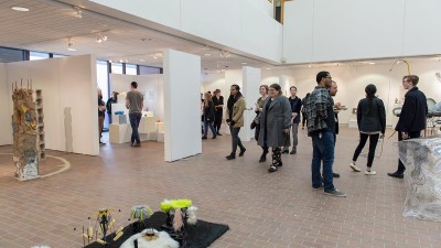 People converse during an opening in Bevier Gallery.