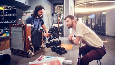 A Cage employee shows a fellow student equipment.