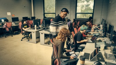 RIT faculty Alesha Williams and her Digital Illustration I students in a computer lab.