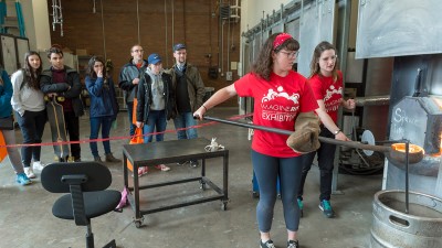 Students give a glassblowing demonstration during the annual Imagine R I T festival.