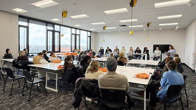 A wide view of a conference in one of RIT's interior design spaces.