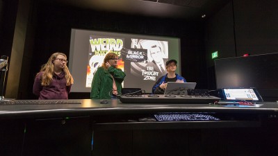 Students present a project in a post-production suite.