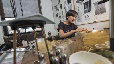 A graduate student in her personal workspace.
