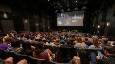 a full auditorium during a lecture.