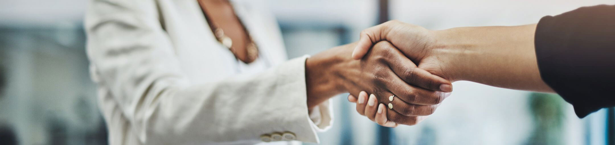 Close up of a two people shaking hands.