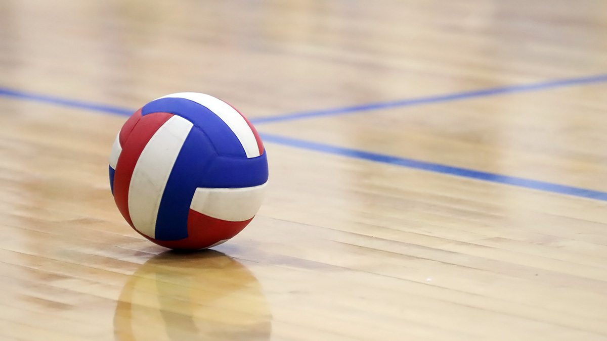 a volleyball sitting on a court.