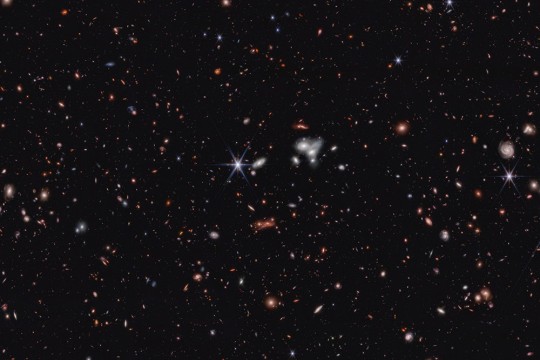 stars in space with circular and oblong shapes.