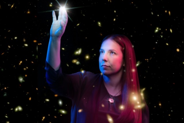 researcher touching a glowing star in space.