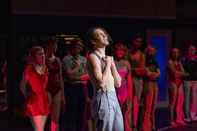 students perform a chorus line musical