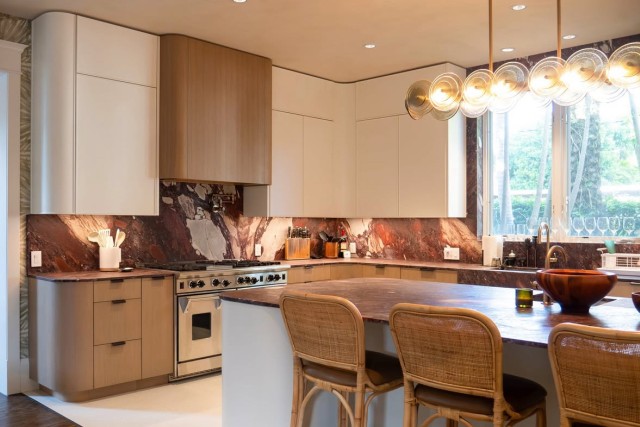 A custom kitchen design with luxury cabinetry and backsplash.