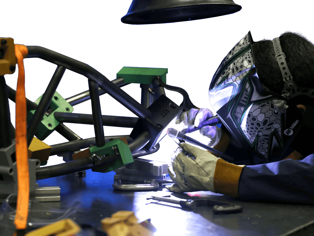 Somone welding with a welding mask on
