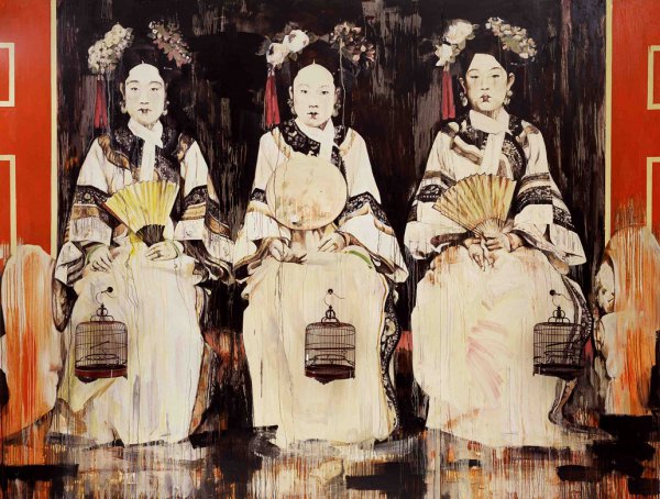 Three Chinese women sitting on a stage