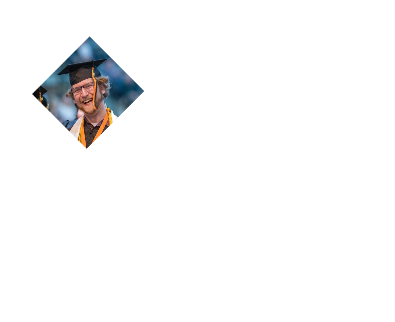 Beared man smiling in a morterboard and gown