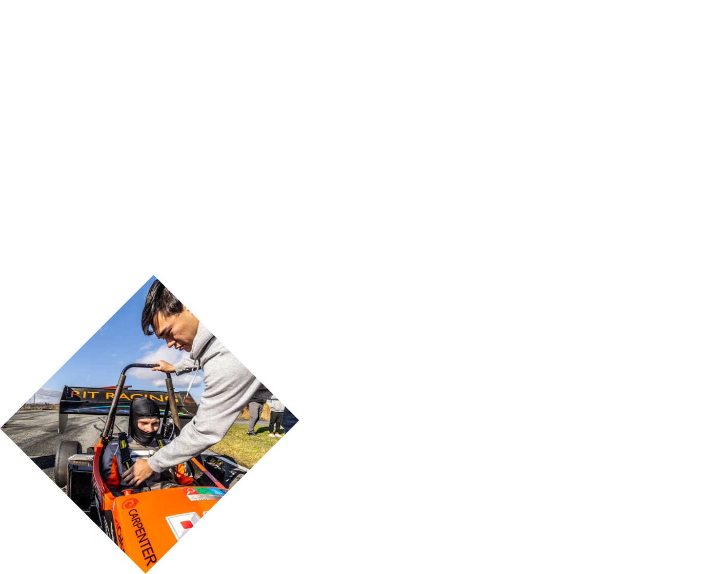 Driver in an open wheel race car