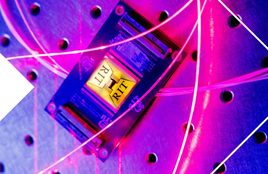 Computer chip underneath pink and purple neon lights