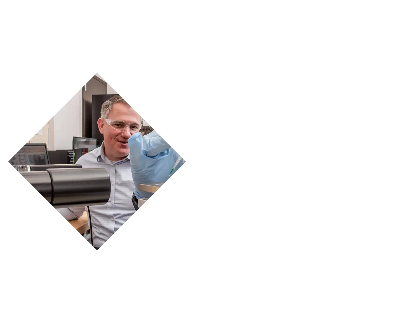 People using pipettes in a lab