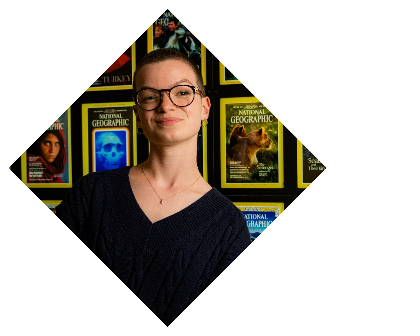 Two people pointing at something off screen