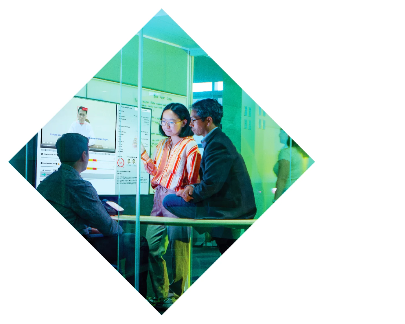 green tinted background of a group of people working on something