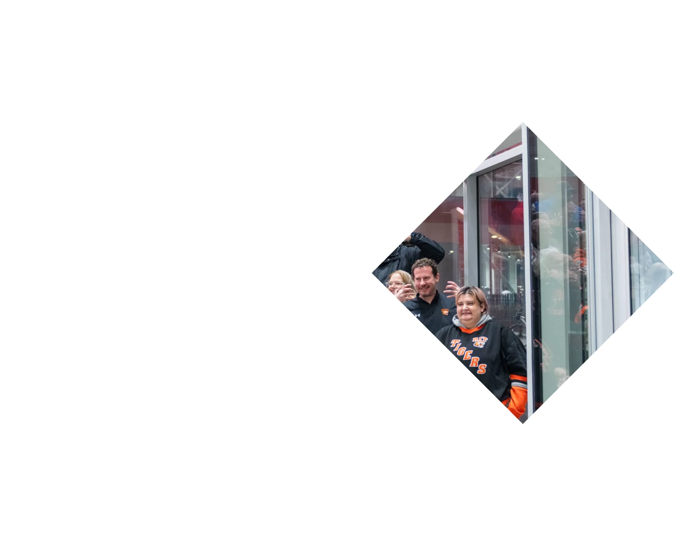 RIT hockey fans posing on stairs