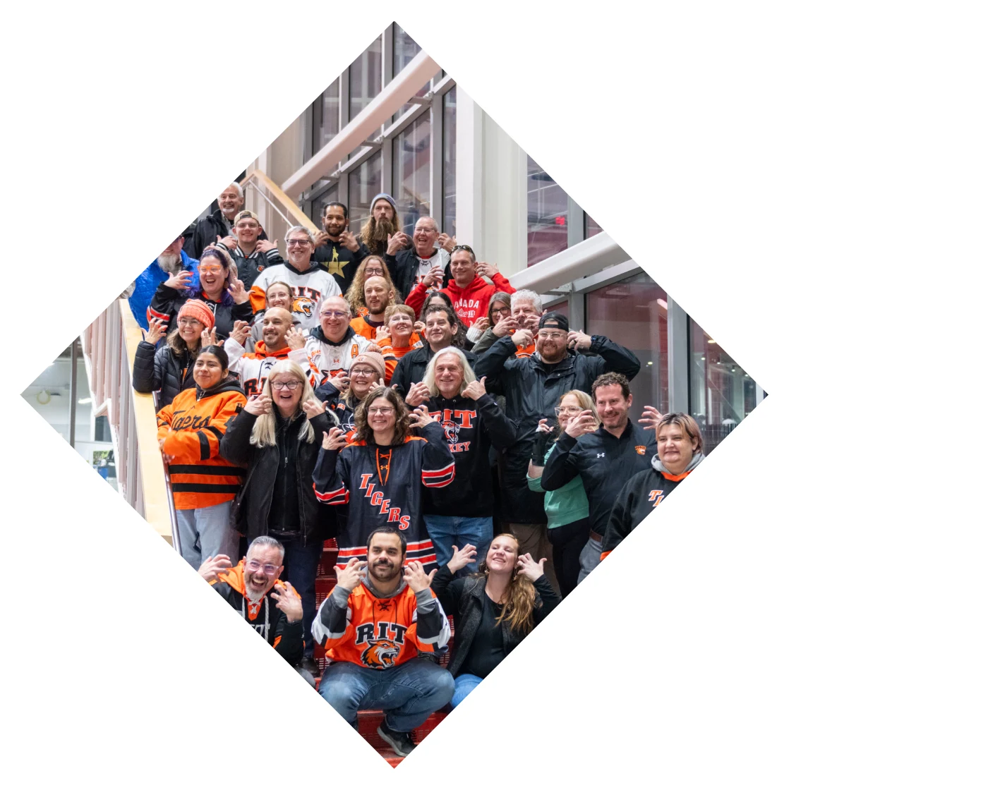 RIT hockey fans posing on stairs