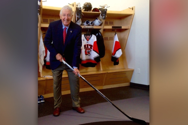 Person holding hockey stick