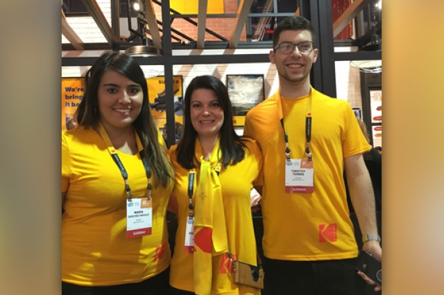 Three people posing for camera