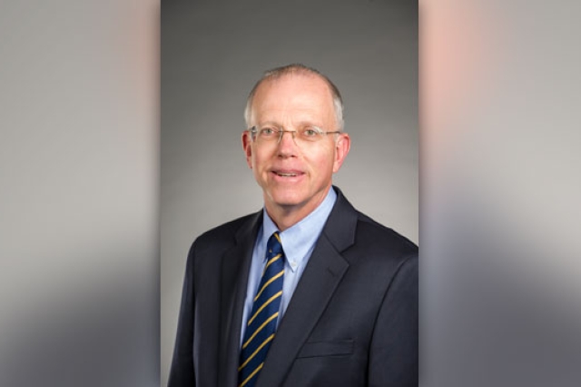 RIT president posing for camera