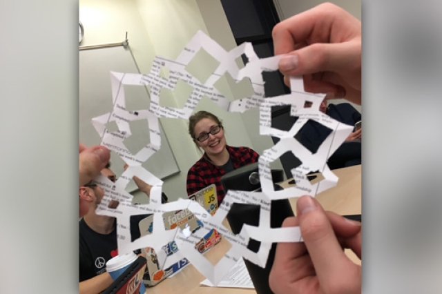 Picture of person framed by paper snowflake