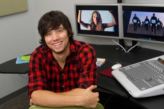 Picture of student in front of desk