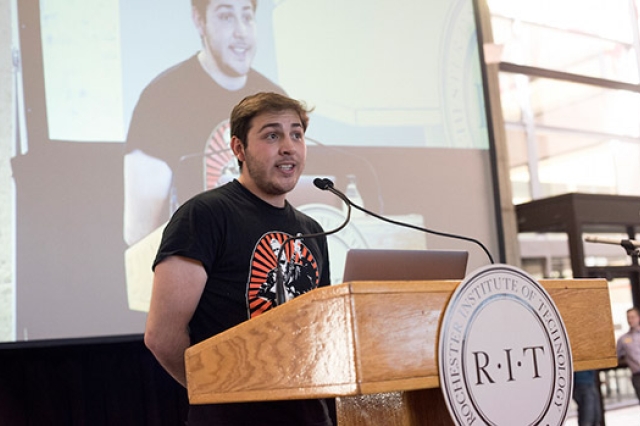 Student speaking at podium 
