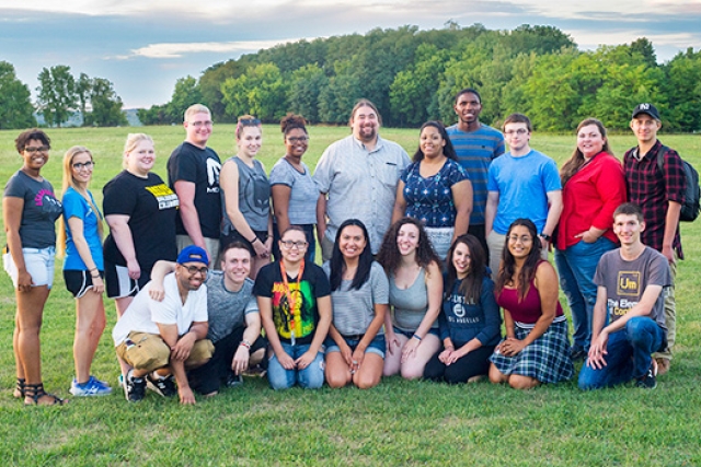 People gathered for picture on field