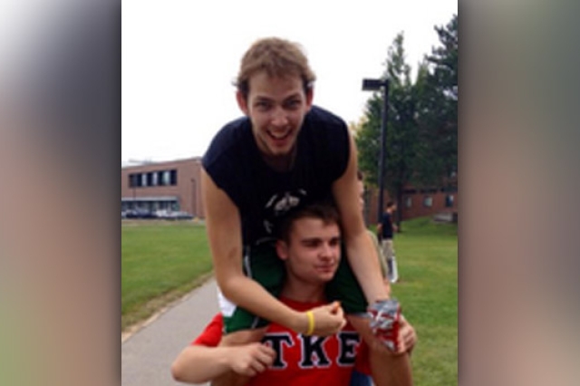 Person sitting on someone's shoulder