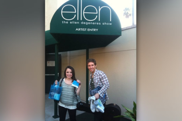 People posing in front of entrance