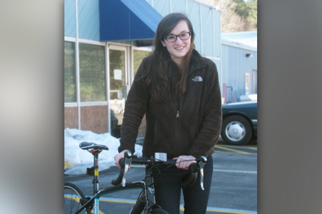 Person posing with bike