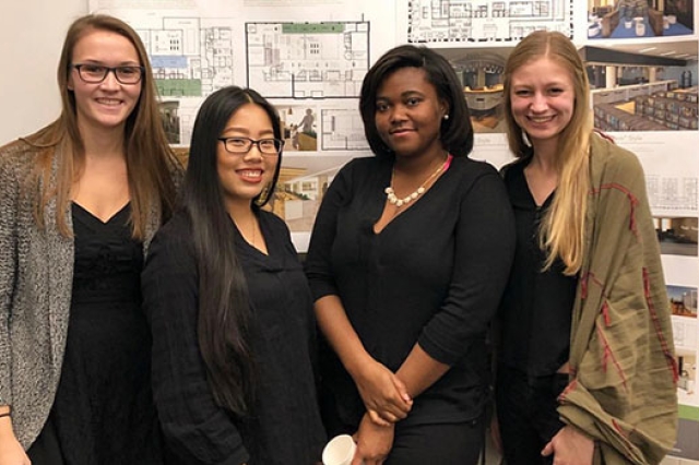 four women pose next to each other.