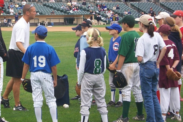 Person coaching kids