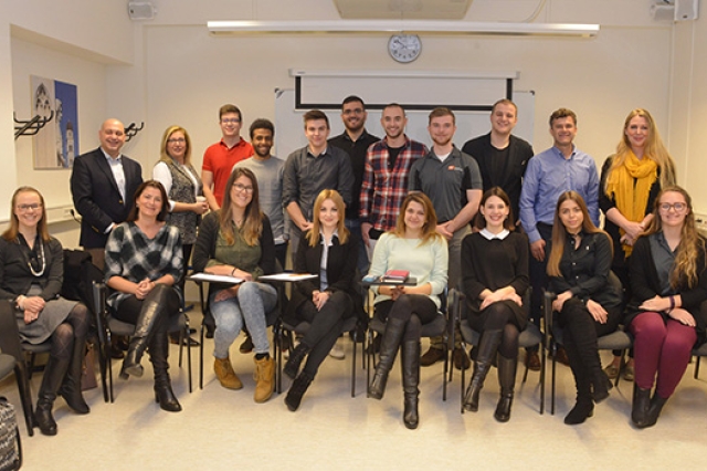 People gathered for picture in classroom