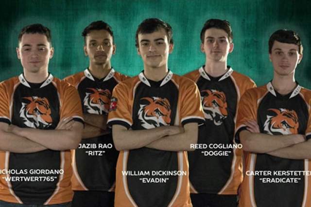 RIT esports team poses for picture wearing matching jerseys.