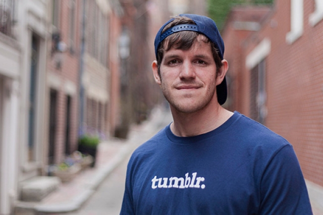 Brandon Stanton standing in a New York City alley.