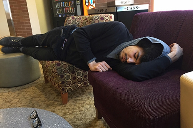 Person sleeping on chairs