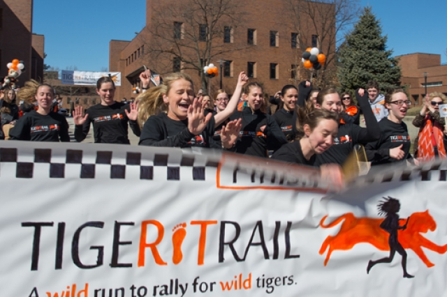 People running into "Tiger Trail" banner