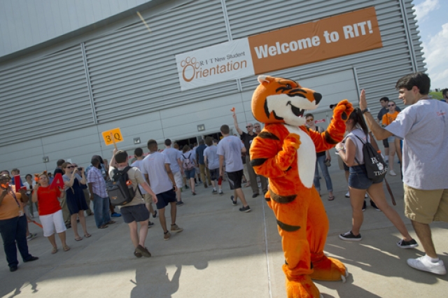 People walking into building