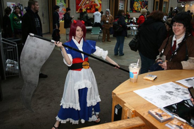 Person posing in costume at event