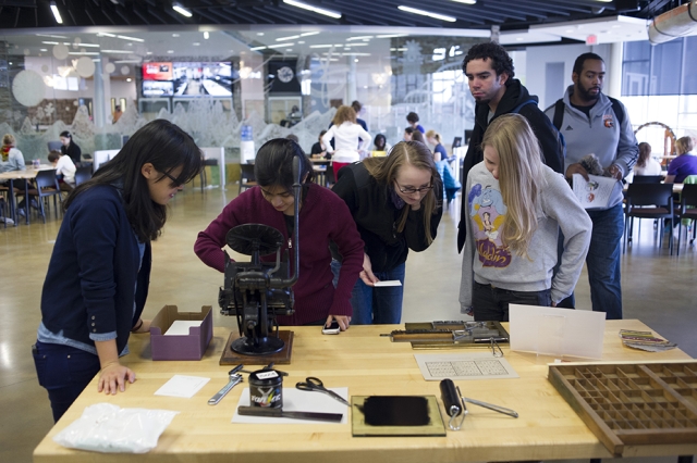 Students viewing various typographic displays