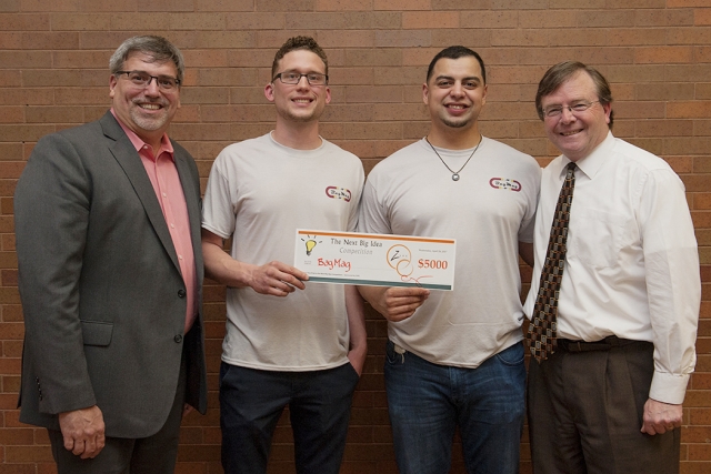 From left to right — Chris Wagner, ZVRS vice president of customer experience and RIT/NTID alumnus and Foundation Board chair; Wade Kellard and Hans Kohls, RIT/NTID students and creators of BAGMAG; and Gerry Buckley, NTID president and RIT vice president and dean, at the Next Big Idea competition.