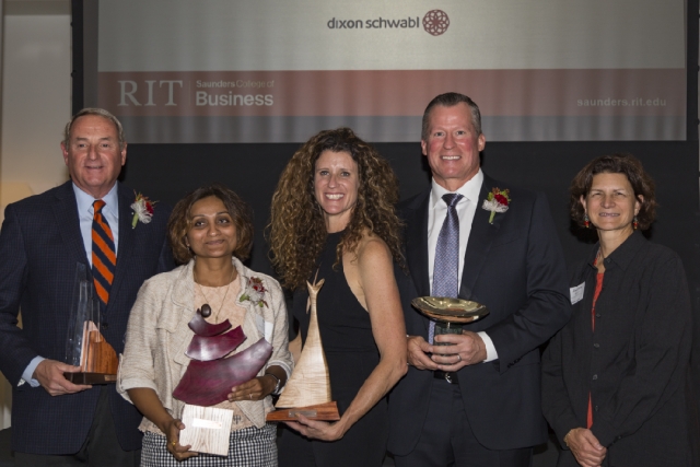 Frank Sklarsky, Dr. Shal Khazanchi, Carin DeMilo, and Scott Ingwers pose with their Recommence awards alongside Dean Jacqueline Mozrall.