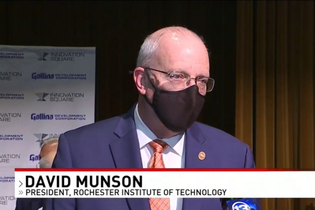 screenshot of RIT president answering TV reporter's questions.