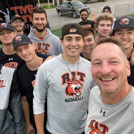 several members of the RIT baseball team posing for a group photo.