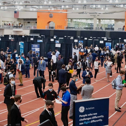 Students attending career fair booths.