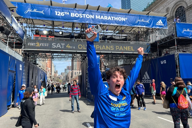 student running through the finish line of the Boston Marathon.